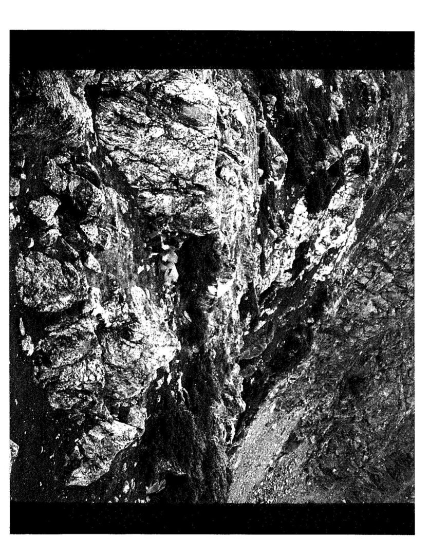 A black and white photo of rocks in the sun.