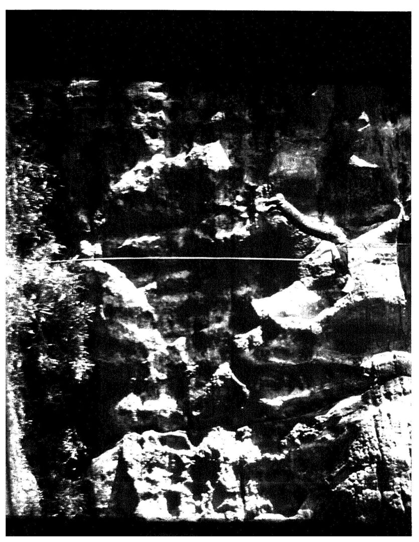 A black and white image of a person in the middle of an area.